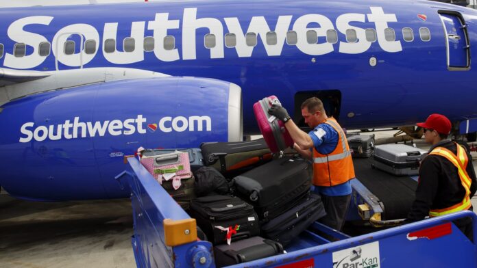 Southwest Airlines will charge for checked bags for first time