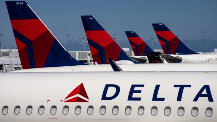 Delta Air Lines slashes earnings outlook, sending shares down