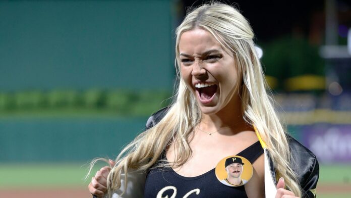 Livvy Dunne cheers on SI models' first pitch before Paul Skenes takes mound