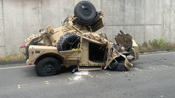 Humvee plunges nearly 30 feet from highway with injuries reported